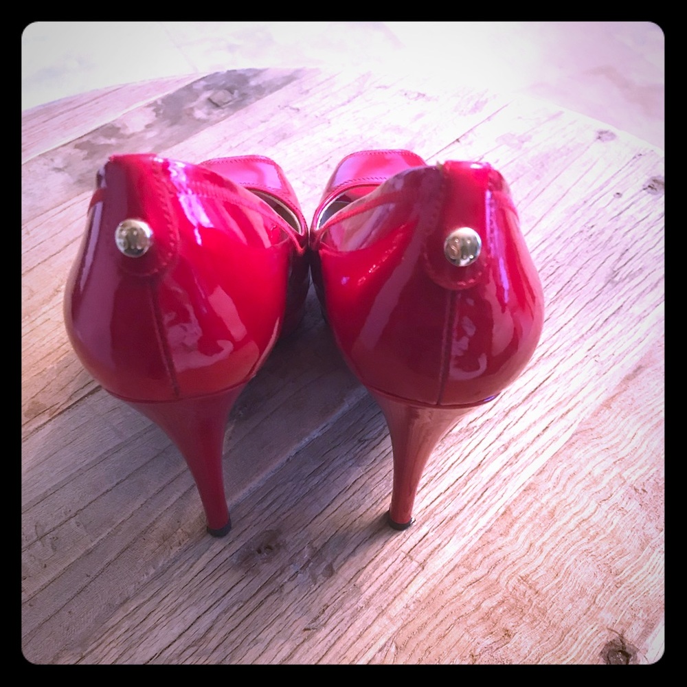 Stuart Weitzman size 8 red peep toe pump.